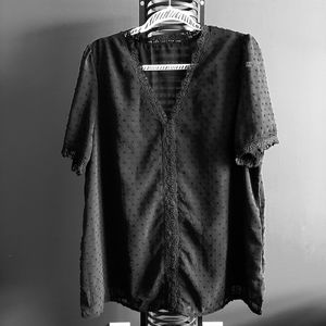 Black short sleeve blouse with v-neck. NEW